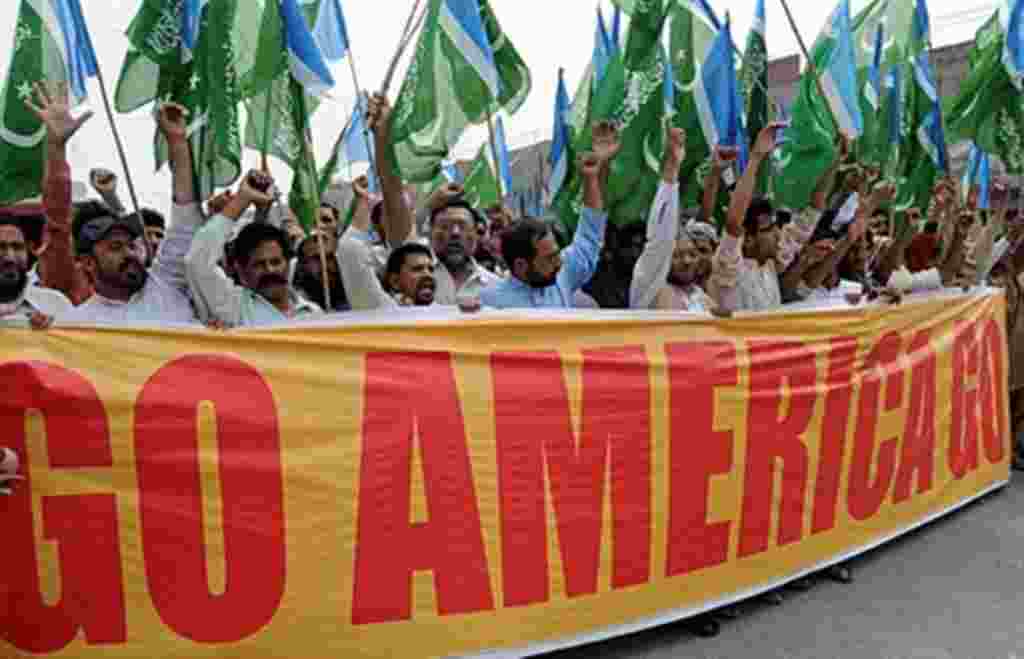 Activists of Jamaat-e-Islami Pakistan shout slogans as they march against the US President Barack Obama for eroding Pakistan's sovereignty with its operation to eliminate Osama bin Laden, in Lahore on May 6, 2011. Hundreds of Pakistanis took to the street
