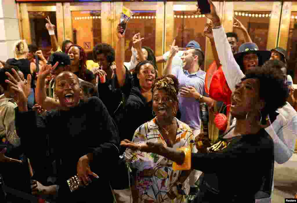 People dance at a block party after attending the opening night of previews for &quot;Pass Over,&quot; following the 17-month shutdown of Broadway due to the COVID-19, at the August Wilson Theatre in New York City, Aug. 4, 2021.