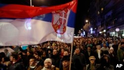 People march during a protest against populist President Aleksandar Vucic in Belgrade, Serbia, Feb. 2, 2019. 