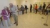 French citizens line up to vote during legislative election in Louveciennes , 12 kms ( 7.5 mls) west of Paris, June 17, 2012.