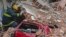 Rescuers work amid the rubble of a building in construction that collapsed killing a least six people and injuring at least 22 in Sao Paulo, Brazil.