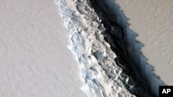 FILE - An aerial photo released by NASA shows a rift in the Antarctic Peninsula's Larsen C ice shelf, Nov. 10, 2016. 