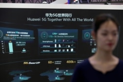 FILE - Information on Huawei's 5G equipment is seen on a screen at the World 5G Exhibition in Beijing, China, Nov. 22, 2019.