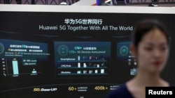 FILE - Information on Huawei's 5G equipment is seen on a screen at the World 5G Exhibition in Beijing, China, Nov. 22, 2019. 