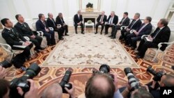 Russian President Vladimir Putin, center right, and Israeli Prime Minister Benjamin Netanyahu, center left, attend the talks in the Kremlin in Moscow, Feb. 27, 2019. 