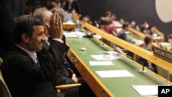Iranian President Mahmoud Ahmadinejad gestures as he arrives at his seat before addressing the 67th session of the UN General Assembly at UN. headquarters in New York, September 26, 2012.