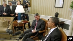 President Barack Obama meets with King Abdullah II of Jordan in the Oval Office of the White House, Jan. 17, 2012.