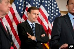 FILE - Sen. Chris Murphy, D-Conn., and colleagues speak with reporters on Capitol Hill in Washington, June 20, 2016.