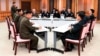 In this Oct. 16, 2018, photo provided by S. Korea Defense Ministry, the U.S.-led UNC, center, South Korean and North Korean, left, military officers attend a meeting at the southern side of Panmunjom in the DMZ, South Korea. 