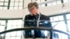 Secretary of State Antony Blinken signs a condolence book at the August 7 Memorial in Nairobi, Kenya, Nov. 17, 2021, which is one of the sites of the 1998 United States embassy bombings that left hundreds of people dead.