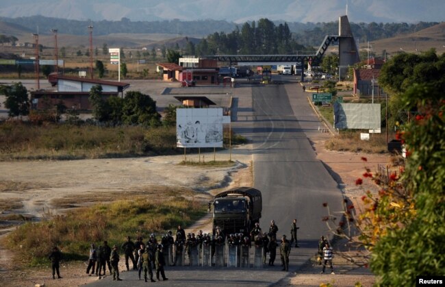 Venezuelan soldiers are seen along the border between Venezuela and Brazil in Pacaraima, Brazil, Feb. 25, 2019.