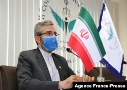 FILE - This handout picture provided by Iran's High Council for Human Rights on May 29, 2021 shows the organization's deputy secretary Ali Bagheri Kani at its premises in the capital Tehran. (Iran's High Council for Human Rights / AFP)