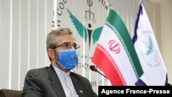 FILE - This handout picture provided by Iran's High Council for Human Rights on May 29, 2021 shows the organization's deputy secretary Ali Bagheri Kani at its premises in the capital Tehran. (Iran's High Council for Human Rights / AFP)