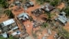 Imagem de drone de casas e edifícios destruídos na sequência do ciclone Chido, em Pemba