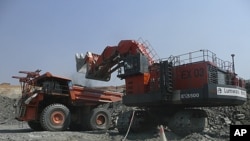 A truck is loaded with rocks at an Equinox copper mine in Lumwana, Zambia, in this undated handout obtained by Reuters, April 4, 2011.