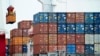 FILE - A container is loaded onto a cargo ship at the Tianjin port in China. 