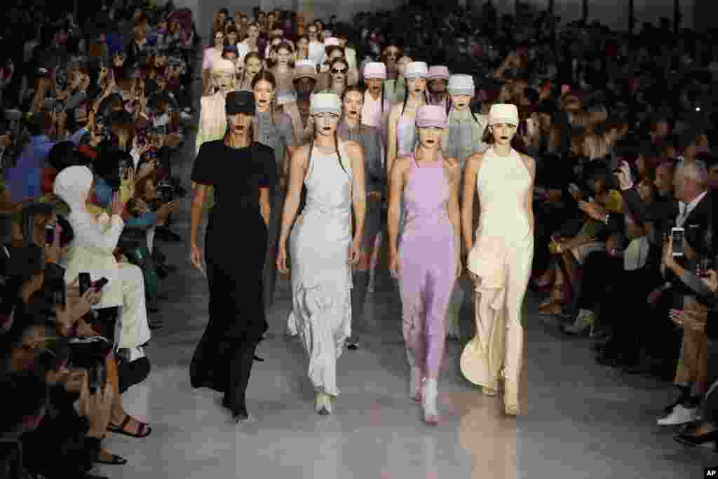 Models present creations during the Max Mara Spring-Summer 2020 collection, during Milan Fashion Week in Italy.