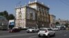 Vehicles drive past the U.S. Embassy in Moscow, Aug. 21, 2017. 