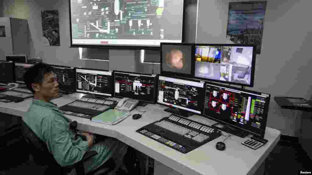 The technician at the controls of a Hong Kong chemical treatment plant control room monitors the incineration of 28 tons of ivory in March, 2014. The process could take a year, according to some officials.