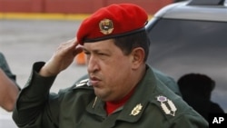 Venezuela's President Hugo Chavez salutes upon his arrival to the Fort Tiuna military base to welcome Ecuador's President Rafael Correa in Caracas, Venezuela, 14 Dec 2010