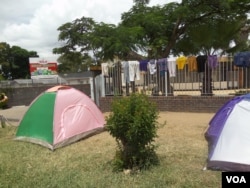 Some former workers have set up makeshift shelter at the GMB headquarters. (Photo: Patricia Mudadigwa)