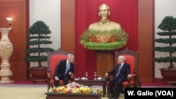 U.S. Secretary of Defense Jim Mattis leans in to listen to Vietnamese Communist Party chief Nguyen Phu Trong at the party's headquarters in Hanoi, Vietnam, Jan. 25, 2018.