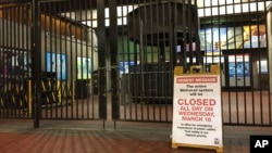 A sign at the Rosslyn, Virginia, Metro station notifies riders that the system is closed for emergency inspection, March 16, 2016. 