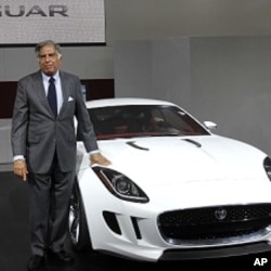 FILE - Ratan Tata is pictured with Jaguar's newly launched C-X16 car during India's Auto Expo, in New Delhi, Jan. 5, 2012.