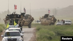 YPG Fighters and US military vehicles