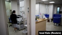 A staff member is seen at a urology clinic as the spread of the coronavirus disease continues in Urawa, north of Tokyo, Japan May 22, 2020. (REUTERS/Issei Kato)