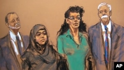 In this courtroom sketch, defendants Noelle Velentzas, center left, and Asia Siddiqui appear in federal court with their attorneys, April 2, 2015, in New York. The two were arrested on charges they plotted to wage violent jihad.