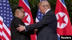 Ким Чен Ын и Дональд Трамп 