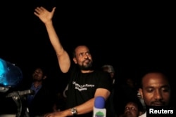 Bekele Gerba, secretary general of the Oromo Federalist Congress (OFC), waves to his supporters during the celebration after his release from prison in Adama town of Oromia region, Ethiopia Feb. 13, 2018.