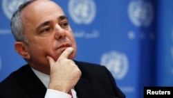 FILE - Minister of Strategic and Intelligence Affairs for International Relations of Israel Yuval Steinitz listens during a news conference.