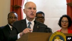 FILE - In this June 13, 2017, file photo, California Gov. Jerry Brown discusses climate change at a news conference in Sacramento. Brown plans to convene a Global Climate Action Summit next year in his latest action to position the state as a leader in battling global warming as the White House recedes. 