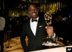 Sterling K. Brown with the award for outstanding lead actor in a drama series for "This Is Us" attends the Governors Ball for the 69th Primetime Emmy Awards at the Los Angeles Convention Center, Sept. 17, 2017