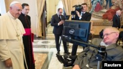 Pope Francis greets Stephen Hawking, theoretical physicist and cosmologist, during a meeting with the Pontifical Academy of Sciences in Vatican, Nov. 28, 2016.