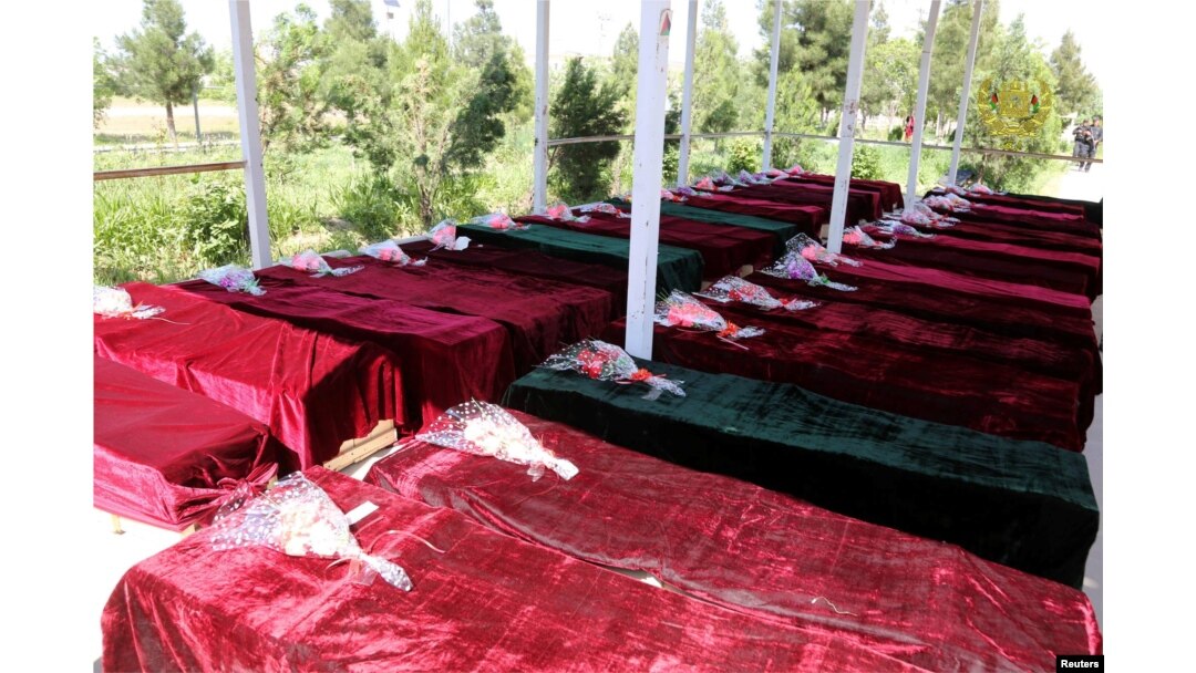 Coffins containing the bodies of Afghan national Army (ANA) soldiers killed in April 21's attack on an army headquarters are lined up in Mazar-i-Sharif, northern Afghanistan, April 22, 2017.