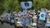 Supporters of Cambodia's opposition Sam Rainsy's party take part in a local commune election rally in Phnom Penh, June 1, 2012.