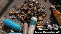 Used oxygen cylinders and beer cans collected en route Mount Everest lie at a facility operated by Agni Ventures, an agency that manages recyclable waste, in Kathmandu, Nepal, Monday, June 24, 2024.