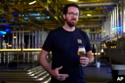 FILE - Head Brewmaster Tobias Zollo gestures during an interview with the Associated Press at the Weihenstephan brewery in Freising, Germany, Friday, Sept. 20, 2024. (AP Photo/Matthias Schrader)