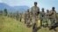 Congolese army soldiers on a reconnaissance mission near Kibumba Hill, around 25km from the provincial capital Goma, in eastern Congo Sunday, Oct. 27, 2013. (AP Photo/Joseph Kay)
