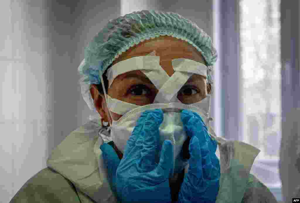A medical worker gets ready for a shift treating coronavirus patients at the Spasokukotsky clinical hospital in Moscow, Russia, April 22, 2020.