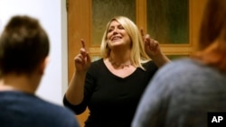 Vocal teacher Sandi Hammond directs members of the Butterfly Music Transgender Chorus during a rehearsal at a church in Cambridge, Mass., Oct. 7, 2015. The chorus was founded by Hammond. 