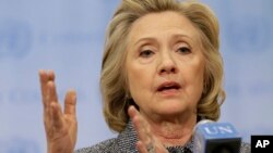 FILE - Hillary Rodham Clinton speaks to reporters at United Nations headquarters in New York, March 10, 2015.