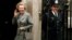 FILE - In this May 11, 1987 file photo, Britain's Prime Minister Margaret Thatcher waves to members of the media on returning to No. 10 Downing Street from Buckingham Palace after a visit with Queen Elizabeth II. 
