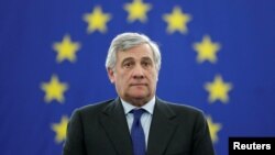 Newly elected European Parliament President Antonio Tajani stands at his desk after the announcement of the results of the election at the European Parliament in Strasbourg, France, Jan. 17, 2017.