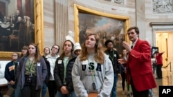 Bridget Cianfaglione, center, and fellow students from Saint John Paul II Catholic High School in Huntsville, Ala., visit the Capitol Rotunda in Washington, March 11, 2020.