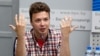 Belarusian dissident journalist Raman Pratasevich gestures while speaking at a news conference at the National Press Center of Ministry of Foreign Affairs in Minsk, Belarus, June 14, 2021. 