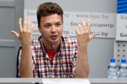FILE - Belarusian dissident journalist Raman Pratasevich gestures while speaking at a news conference at the National Press Center of Ministry of Foreign Affairs in Minsk, Belarus, June 14, 2021.